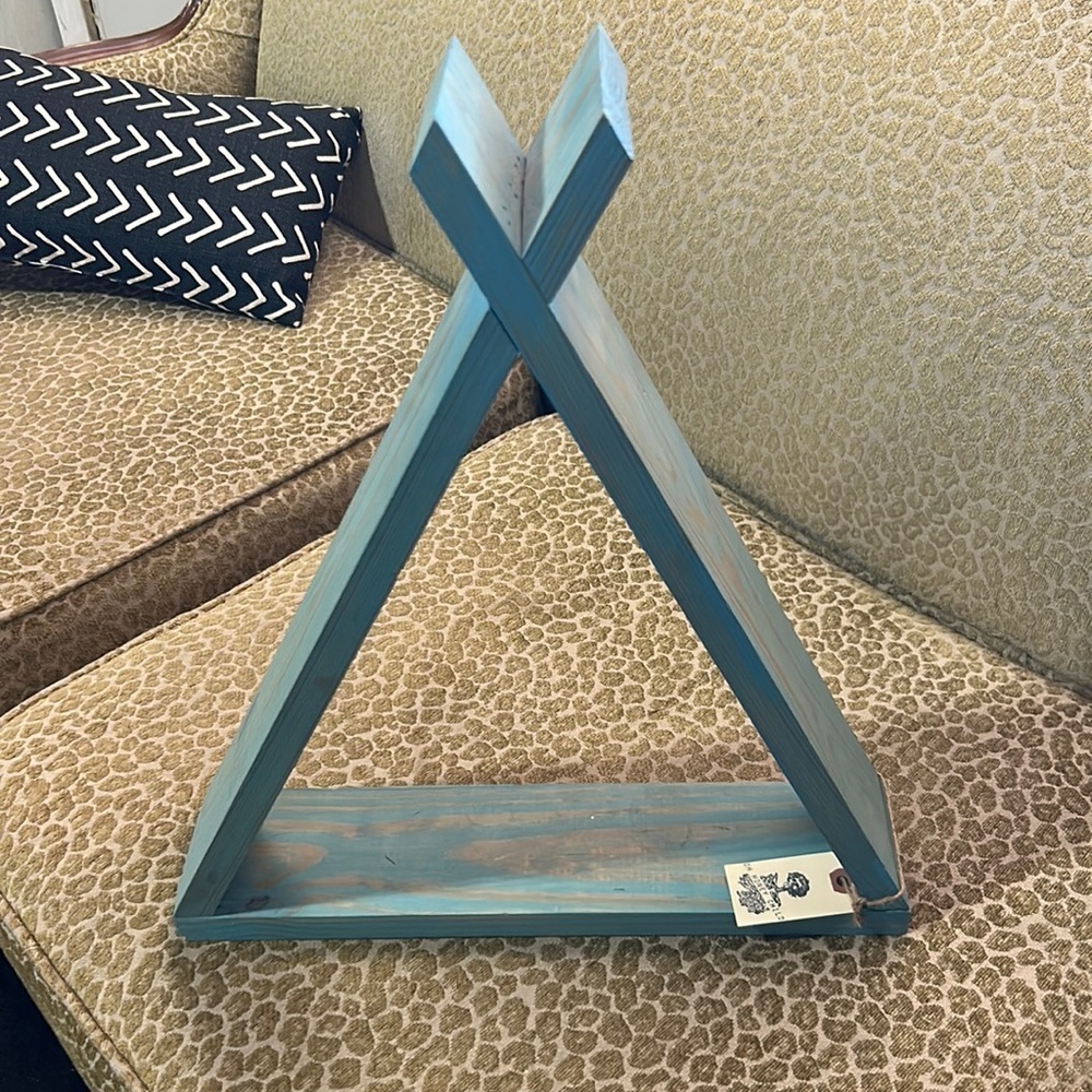 Decorative Teel wooden teepee. Can be sitting or hung on a wall.